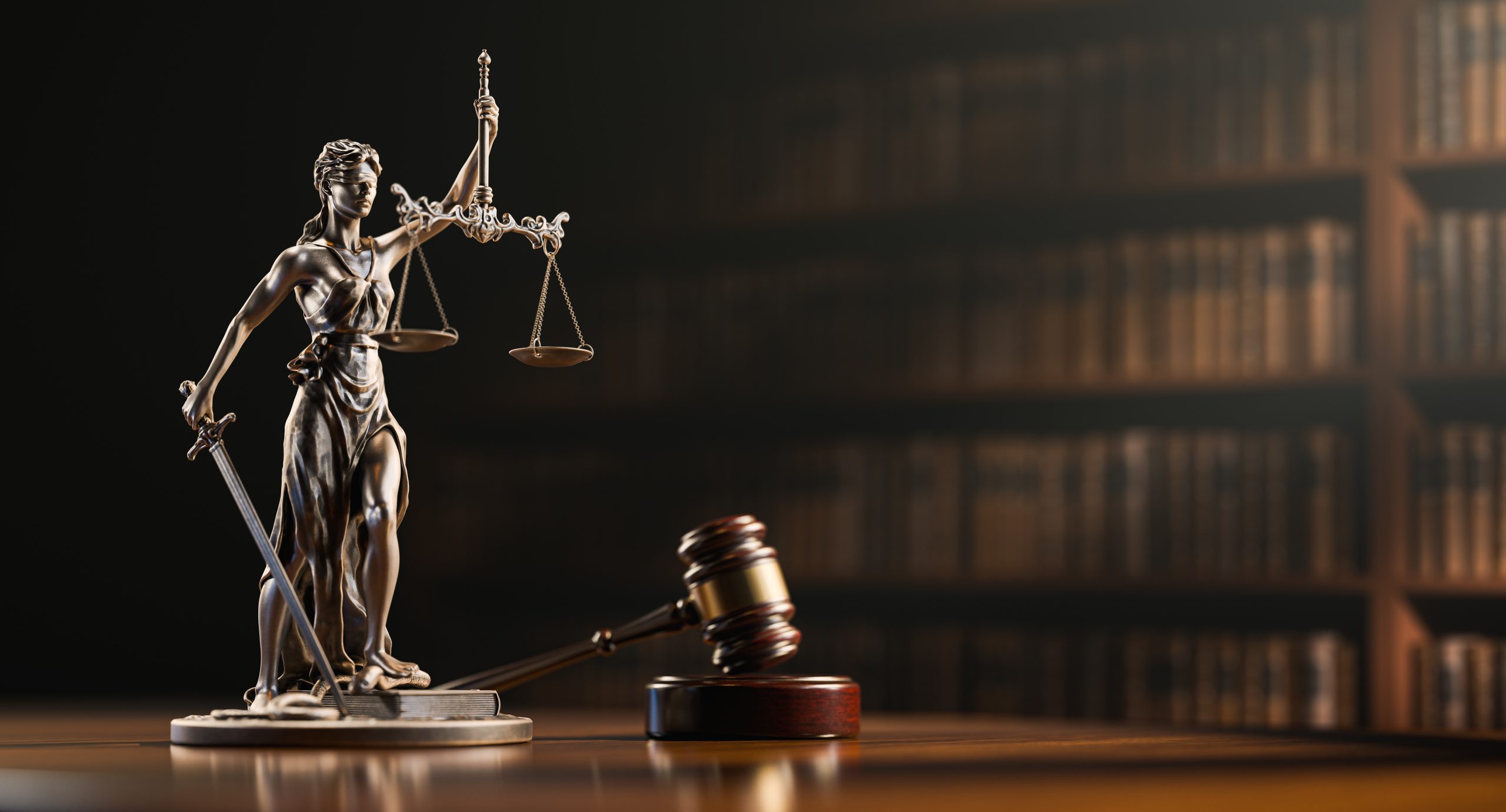 Legal Concept: Themis is the goddess of justice and the judge’s gavel hammer as a symbol of law and order on the background of books.