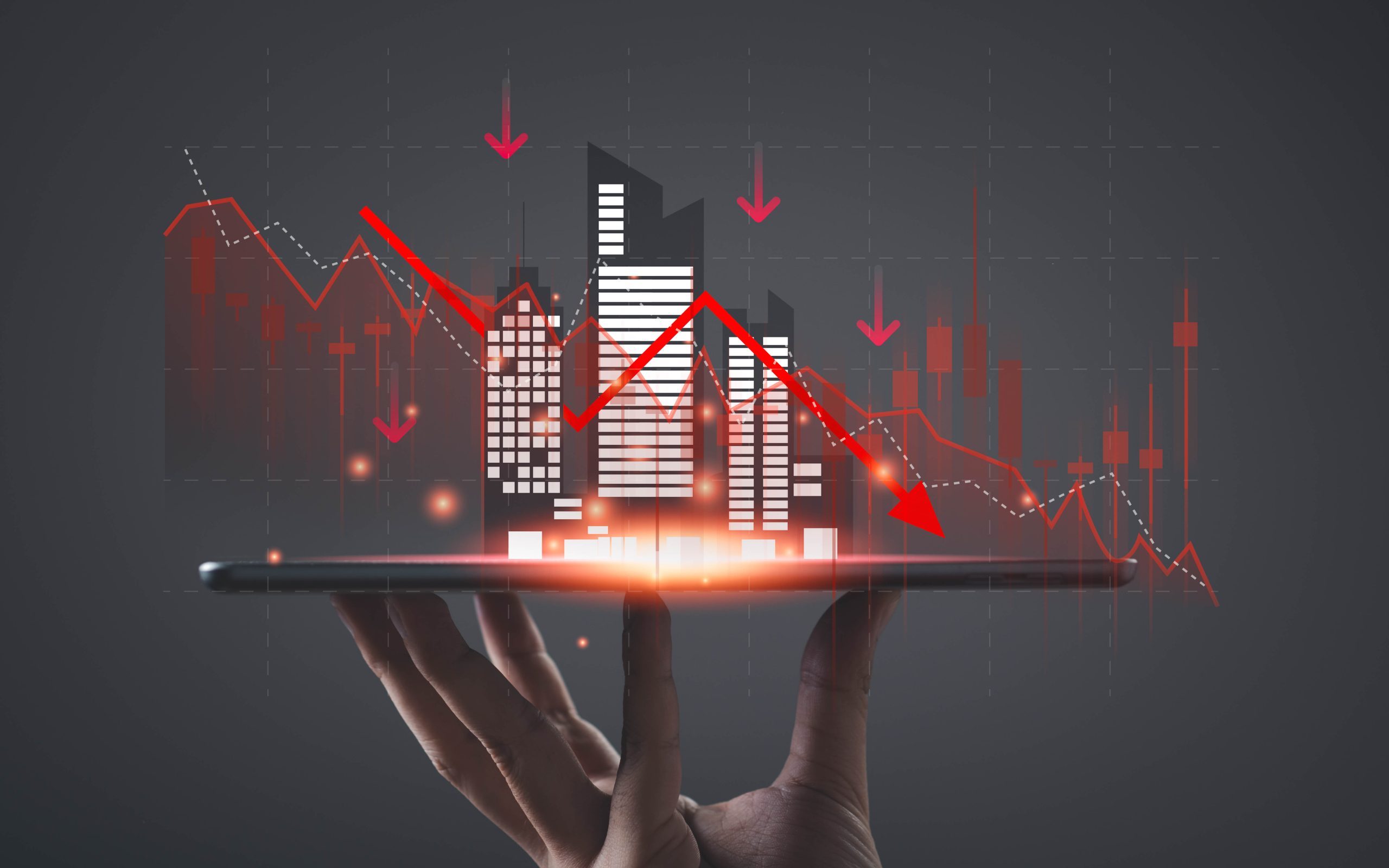Financial market crash concept with declining stock graph and city skyline on digital tablet, representing economic recession, investment risk, trading loss, financial crisis and bearish trend.